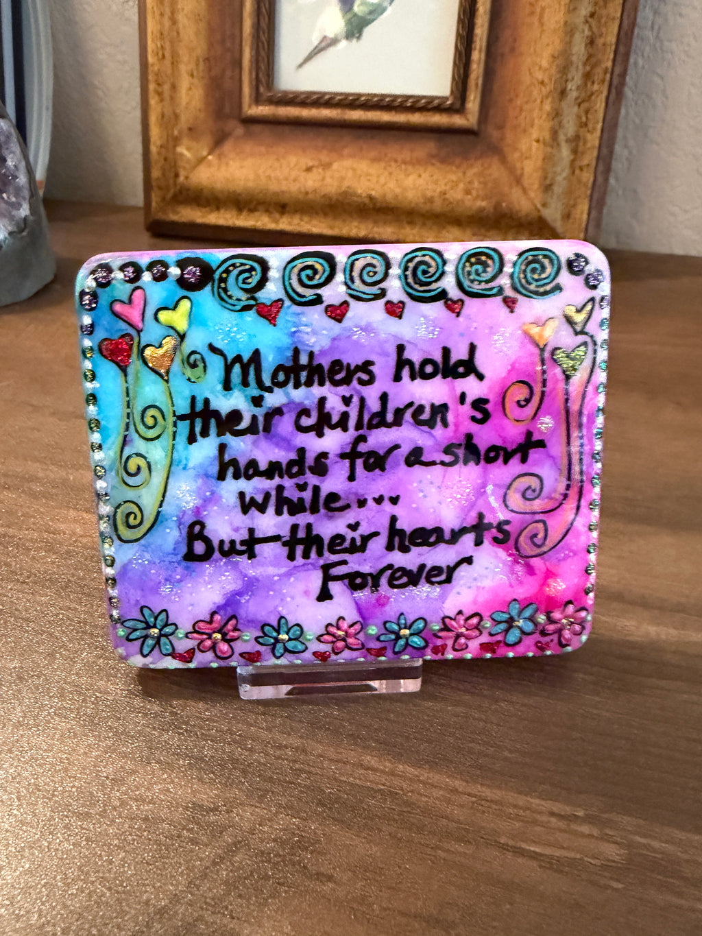 Desk Stone: Mothers Hold their children's hands for a short while...