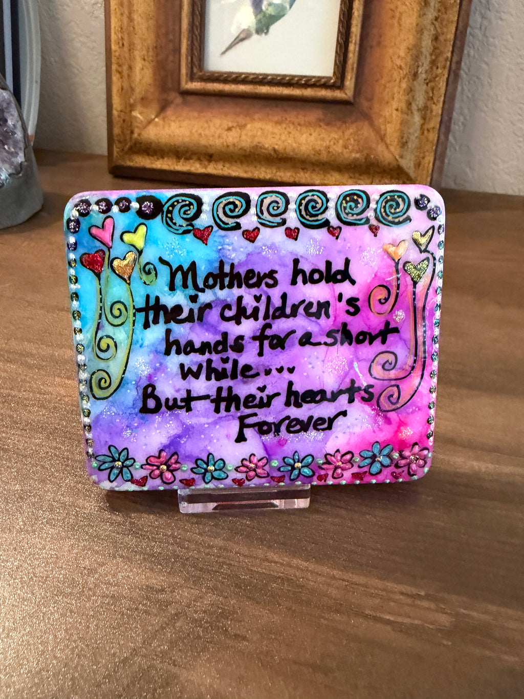 Desk Stone: Mothers Hold their children's hands for a short while...