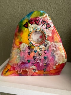 Colorful hand-painted clock with decorative patterns